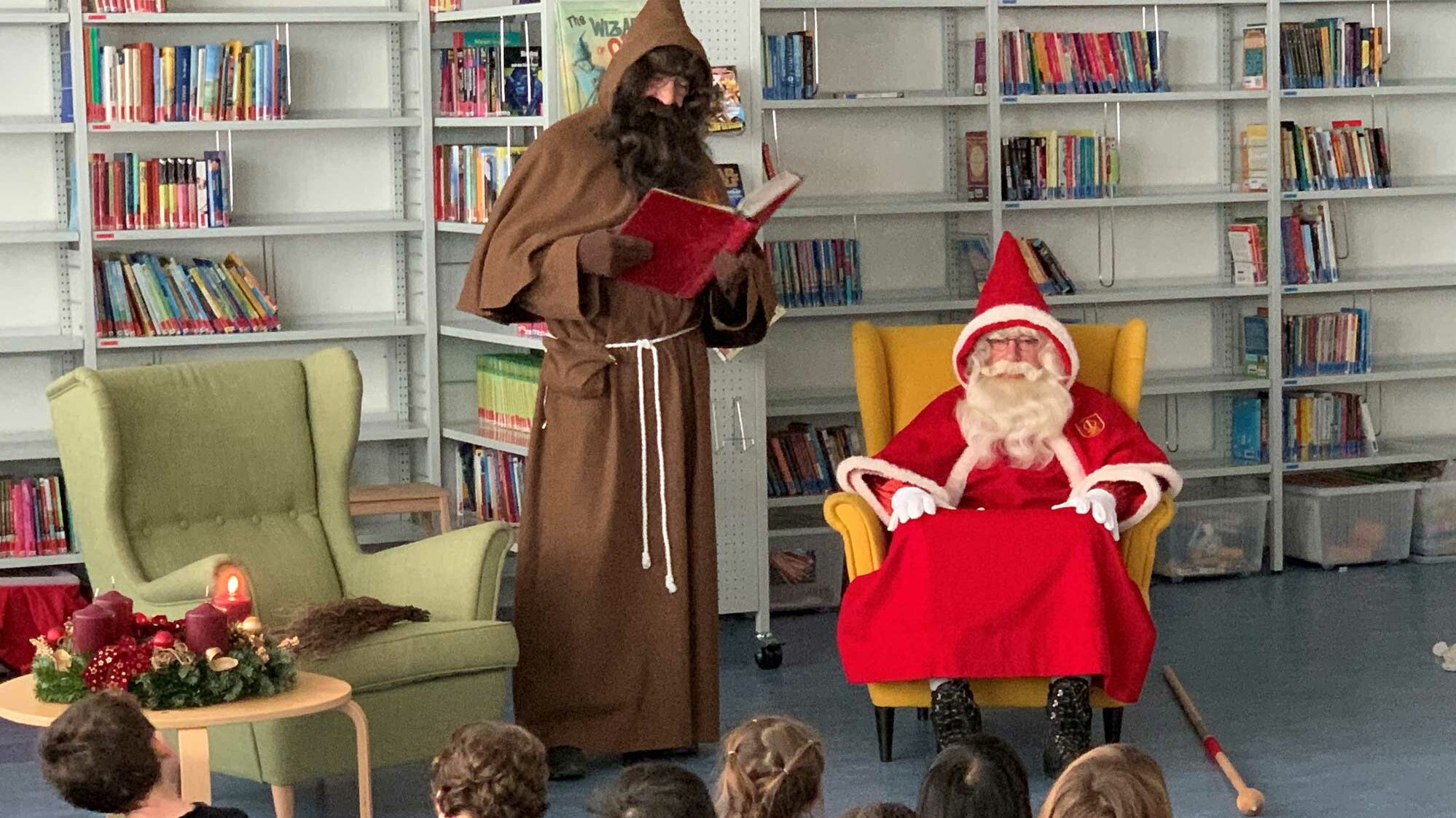 Samichlaus visits the primary school students at school.	